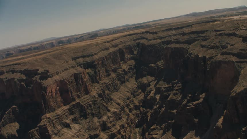 The canyon has a notch in the middle with a trail