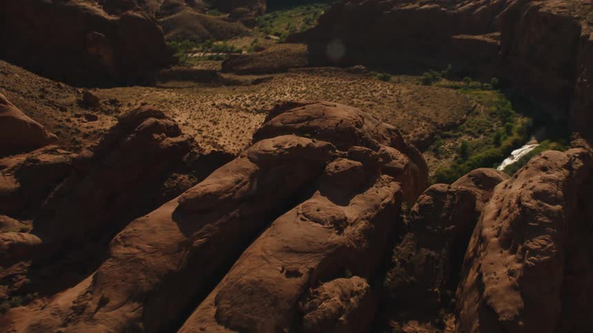 Aerial view of a river flowing past canyons