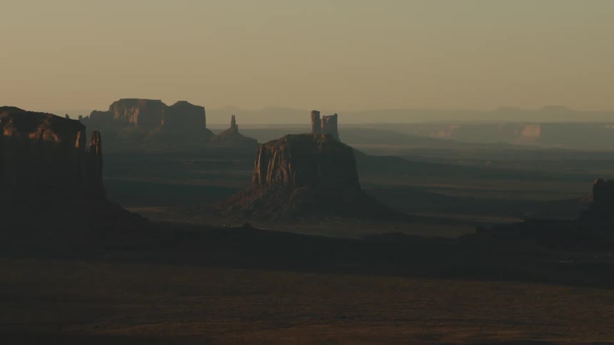 Fog obscures land between mesa in badlands
