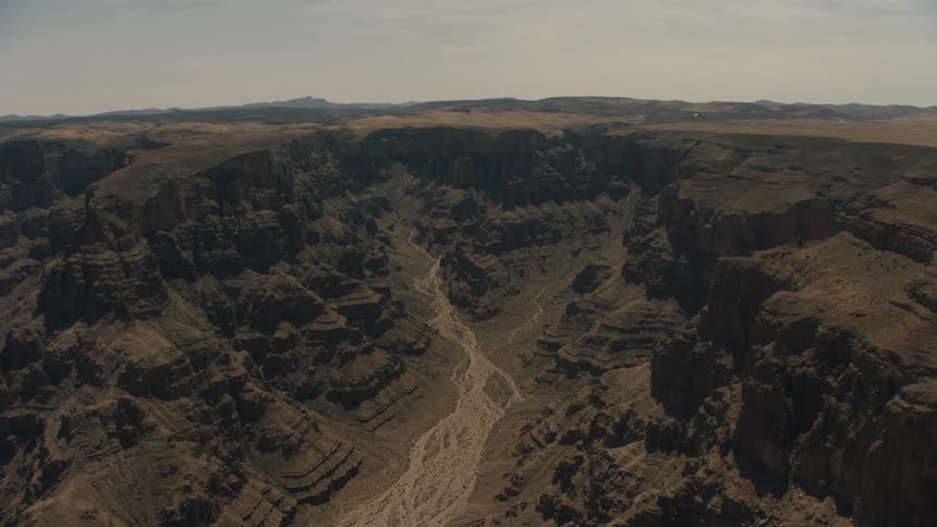 The canyon has a path in the middle covered in sand