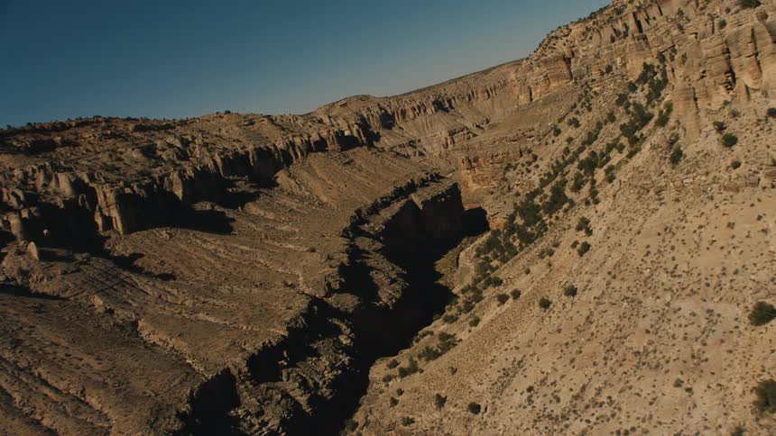 The trail runs through the tall mountains