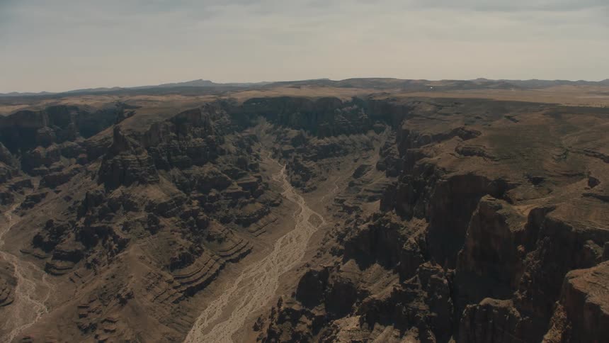 A vast canyon in the badlands during the day