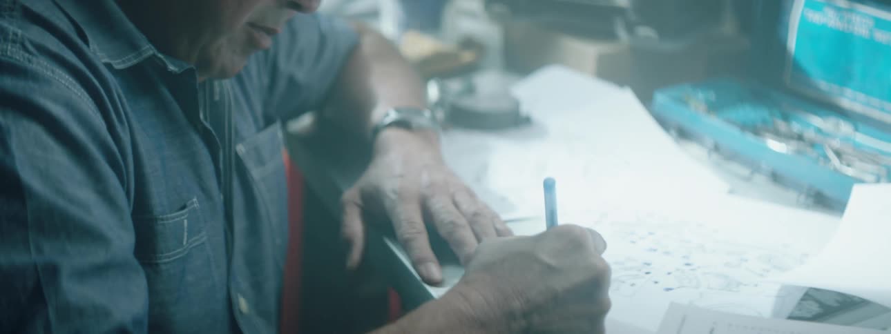 A mechanic fills out paperwork