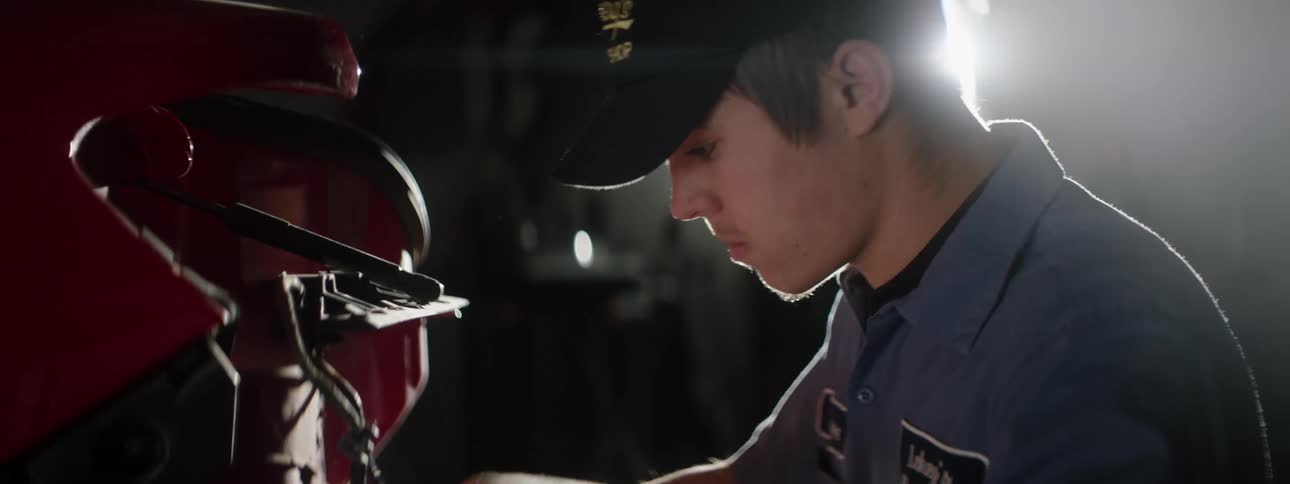 A mechanic working on a vehicle