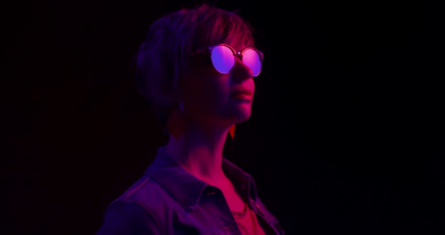 A graphic of a woman is in a dark area