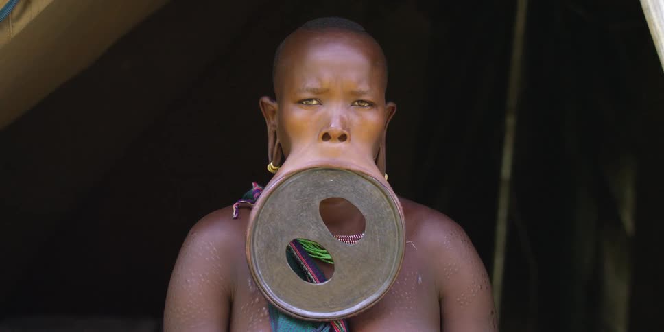 Close up of a woman wearing a large lip plate