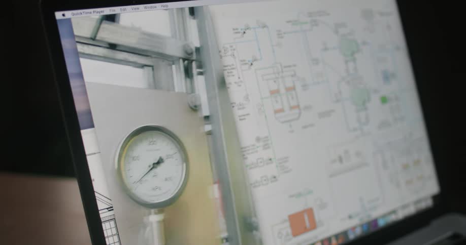Worker on site shows gauge in video call with office