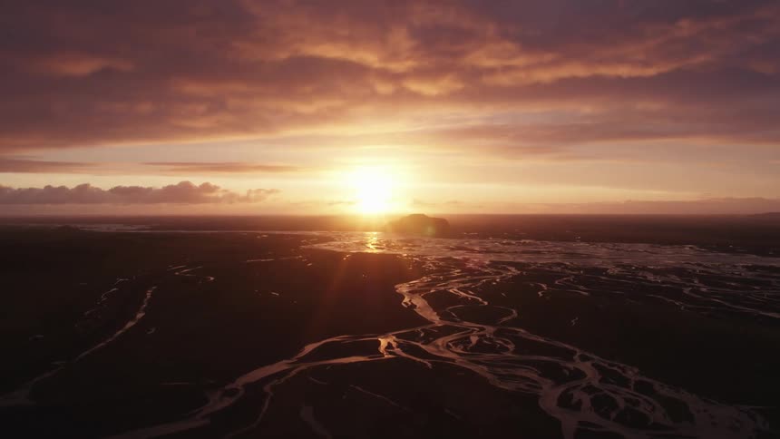 The sun setting over the beach