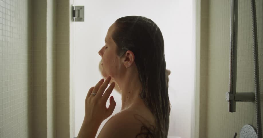 A woman is taking a shower