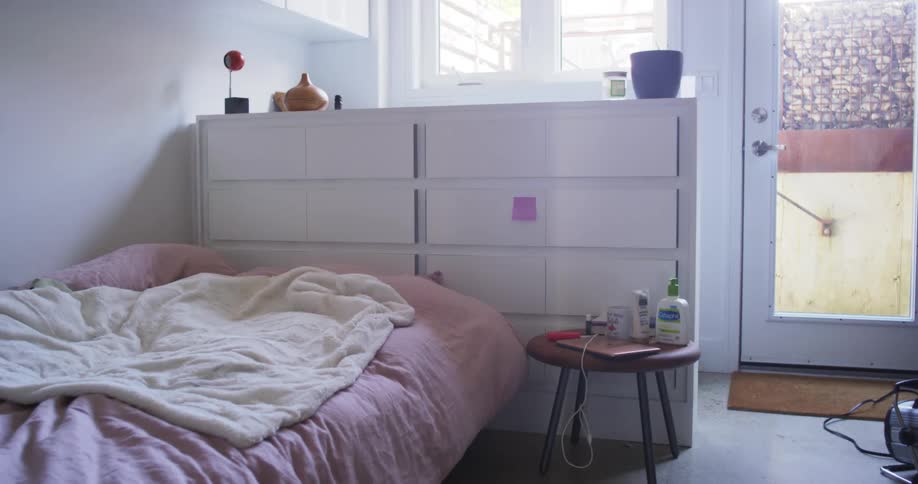 Sunlight shining into the windows of a small bedroom