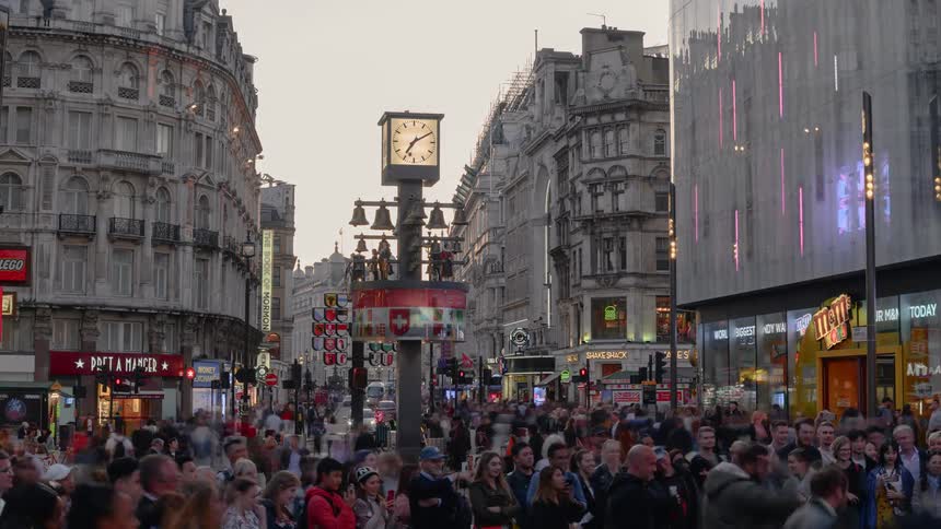 People gather and walk around the city street