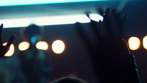A crowd of people are at a concert