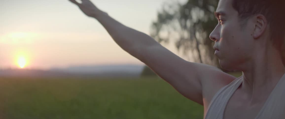 A teenager practices yoga outside