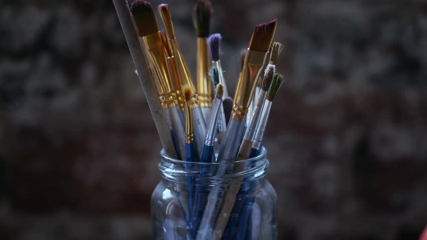 A jar of paintbrushes