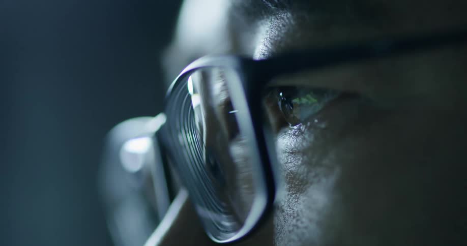 A person looks at something with glasses on