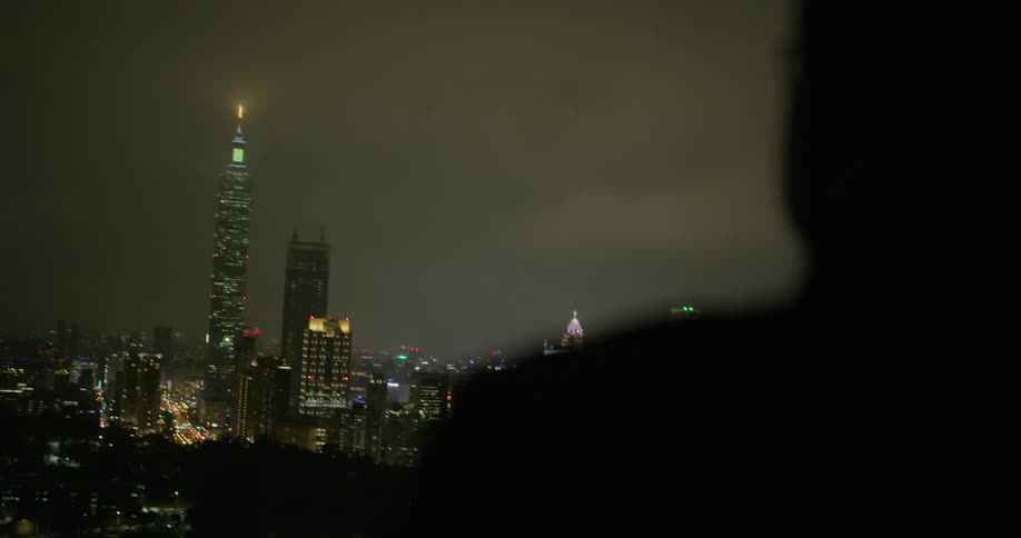 A man seeing city scenery in the night