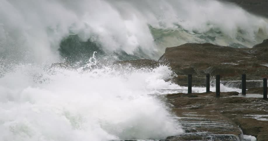 Heavy waves crash against the shore