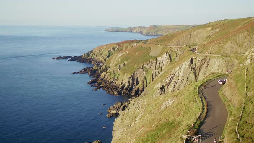A narrow mountain road on a gentle mountain range bordering the sea