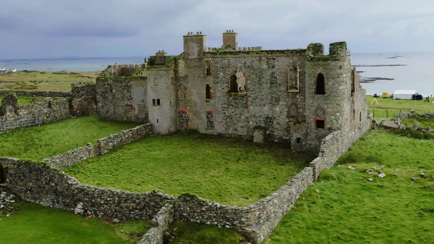 Aerial view of the ruins of a castle in the highlands