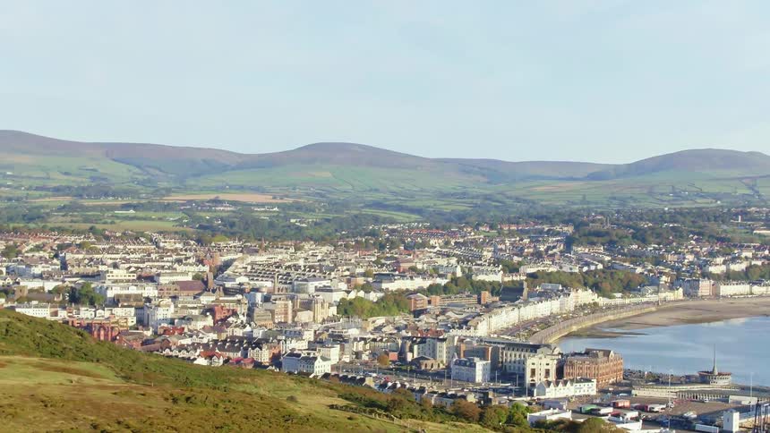 Aerial view of small town in the hills near the ocean