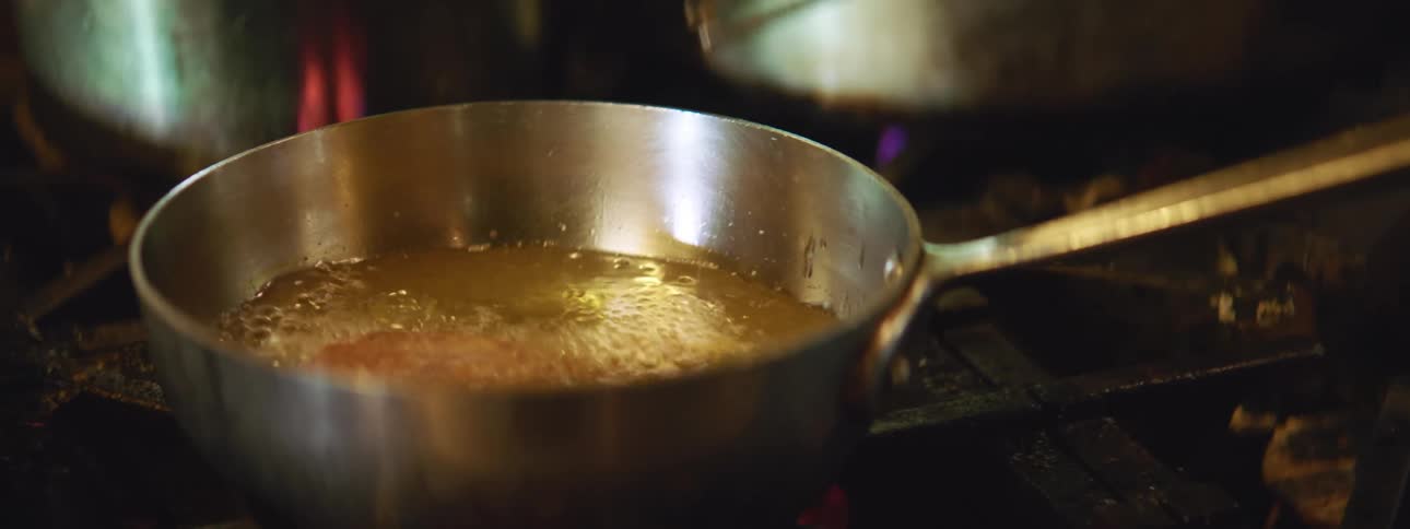 Food being prepared on a frying pan