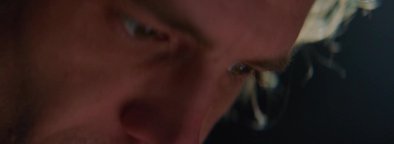 A white man stares intensely