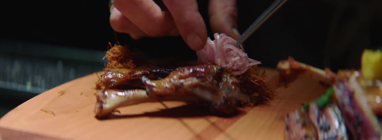 A person is preparing food on a cutting board