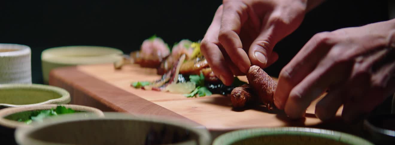 A person is preparing food on a cutting board