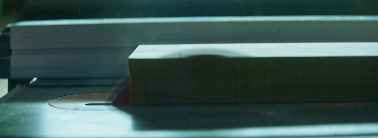 Table saw cuts through a block of wood