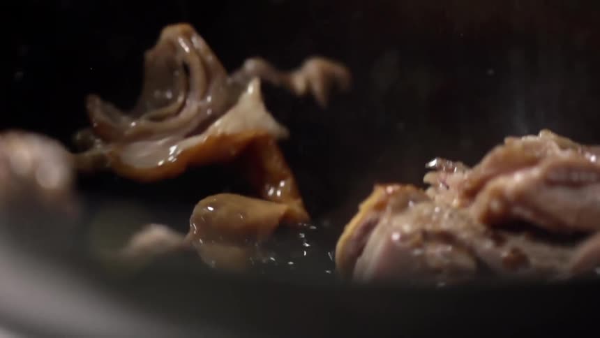 Meat going in to a hot pan with oil