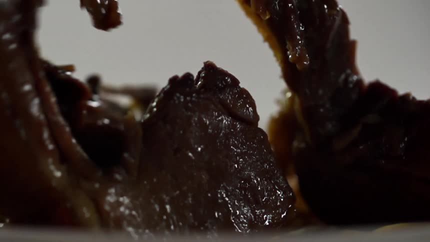 Meat is dropped into the noodles