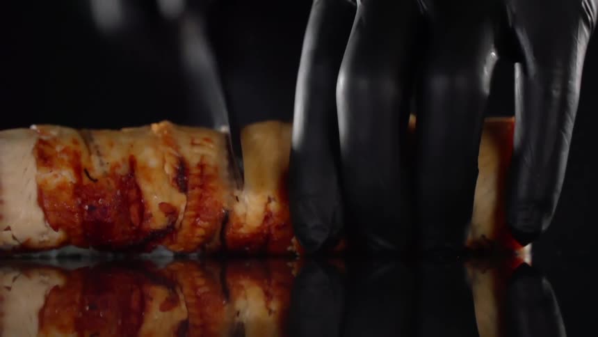 A person slices some food