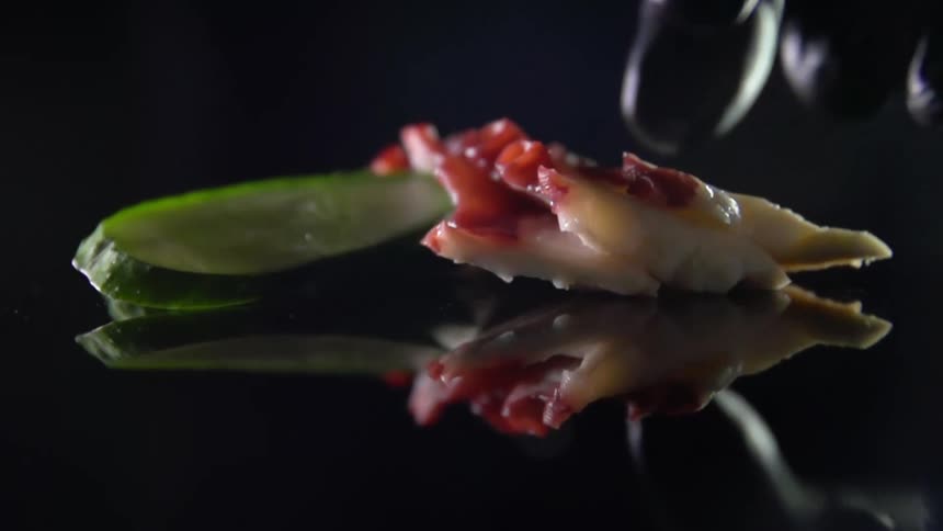 A person plating food