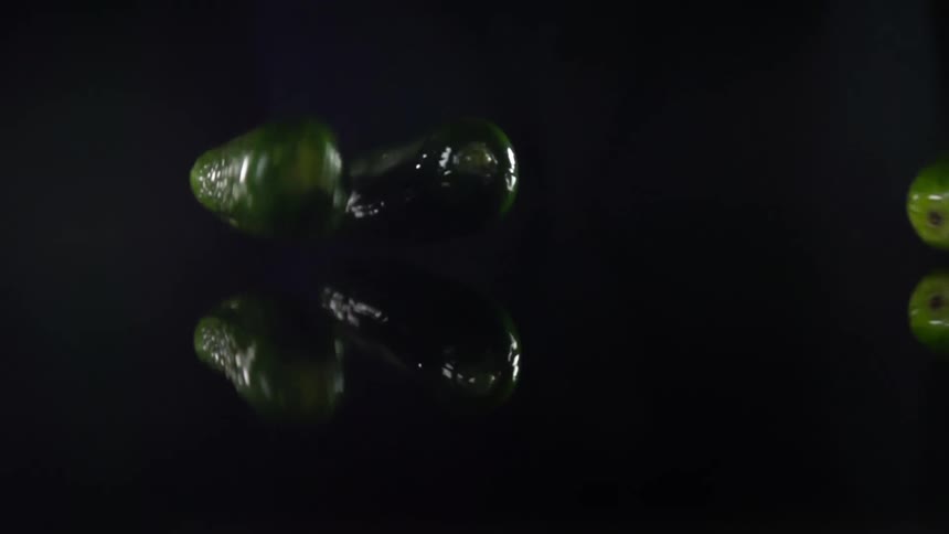 Cucumbers falling on to a counter