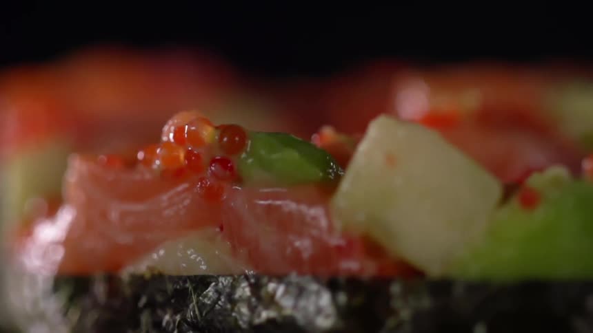 Roe and salmon sushi roll wrapped in seaweed