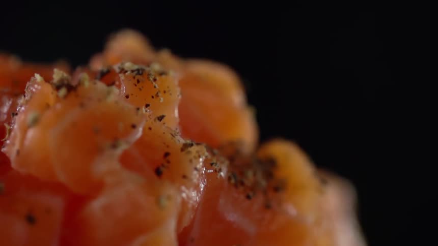 Pepper being put on food