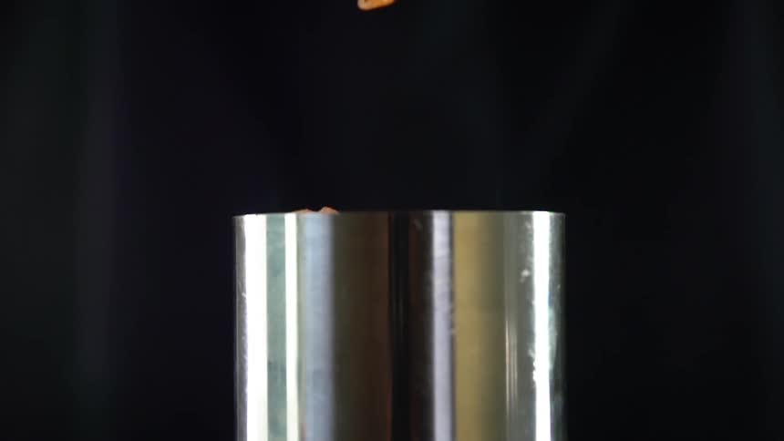 Food falling in to a canister for a photo shoot