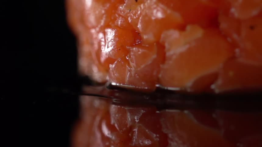 A piece of salmon on a counter top
