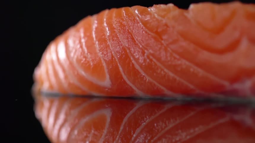 A piece of salmon on a counter top