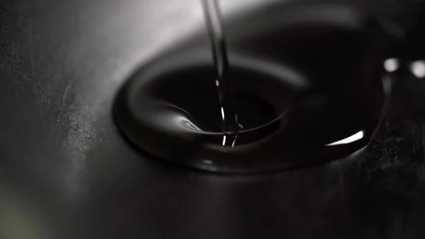Oil is being poured on the pan