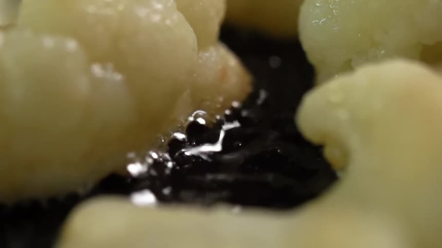 Oil boiling as cauliflowers are fried in it