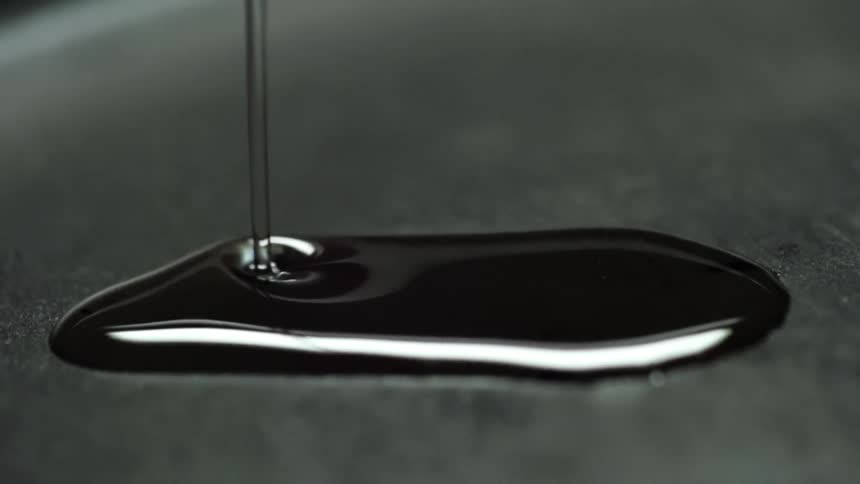 Oil being poured onto a pan