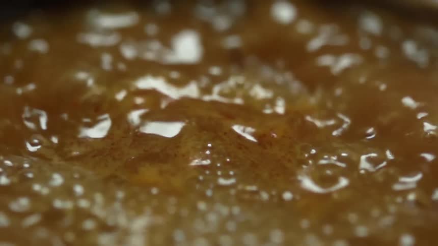 Close up of bubbles in boiling broth