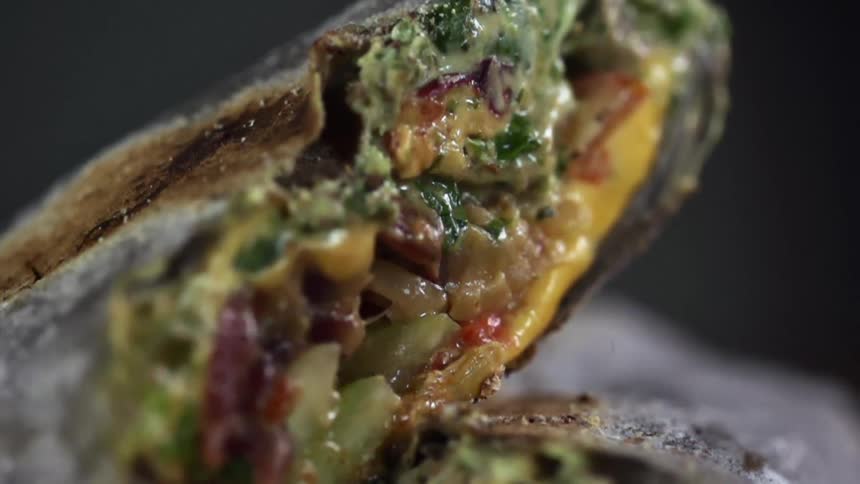 Seasoning falling on a sandwich for a photo shoot