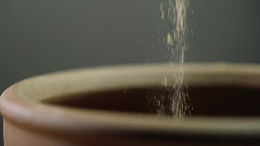 Seasoning being put in to a bowl