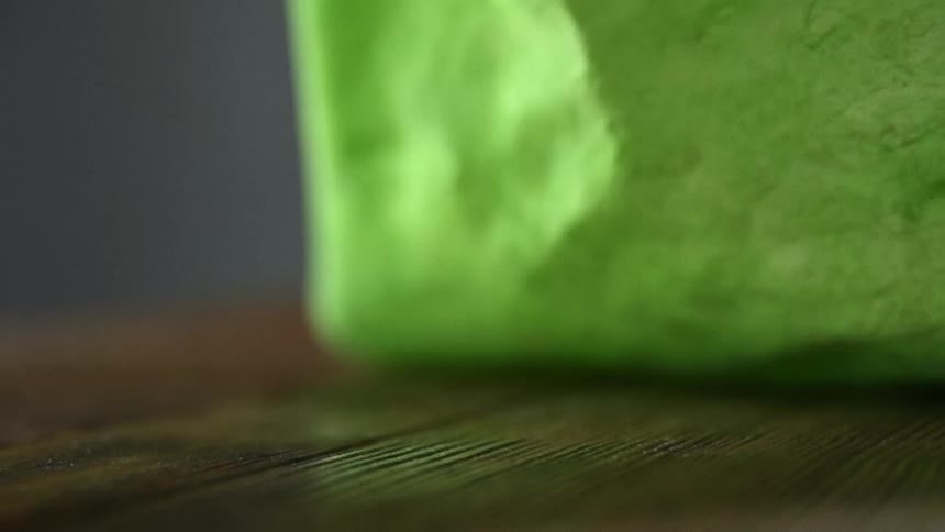A person unrolls a tortilla
