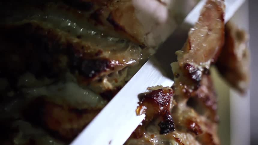 Meat being cut indoors