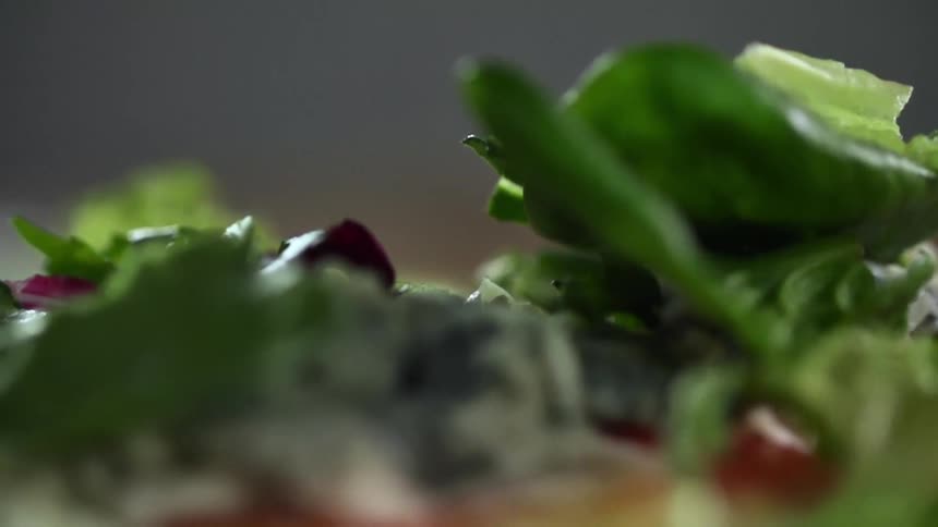 Lettuce is dropped on the salad
