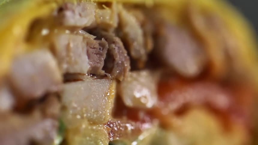 Meat and vegetables inside of a wrap