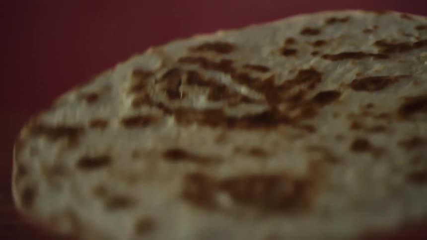 A tortilla being flipped over